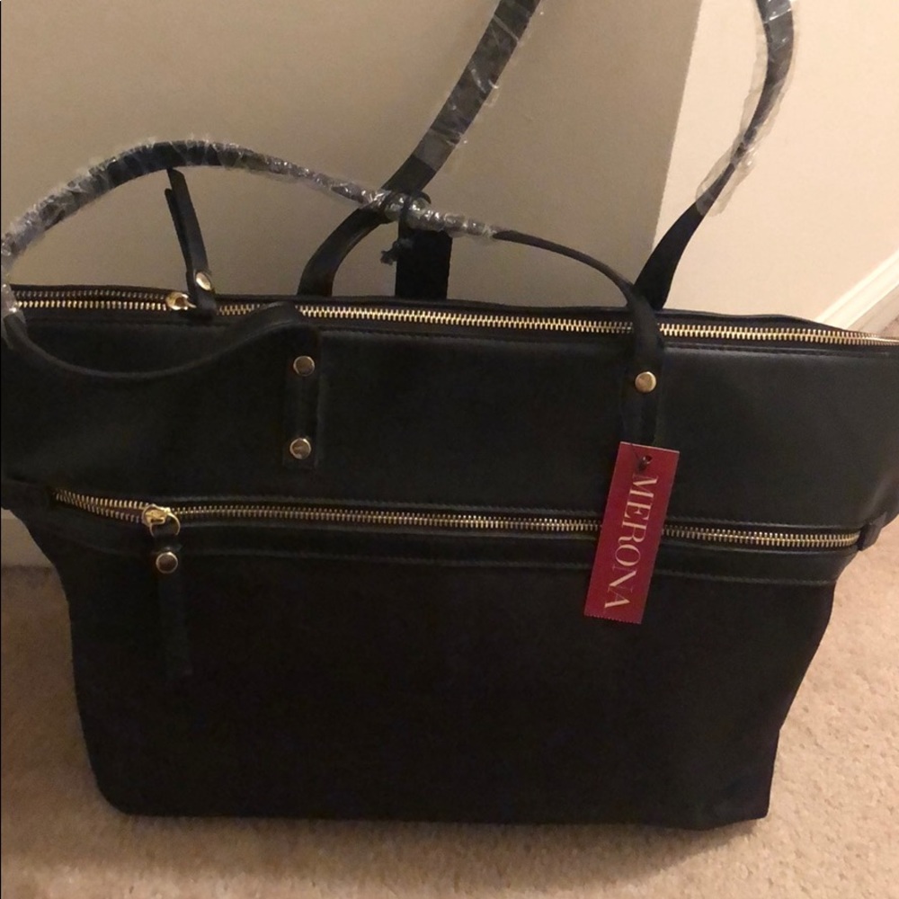 Black tote with multiple pockets and zippers